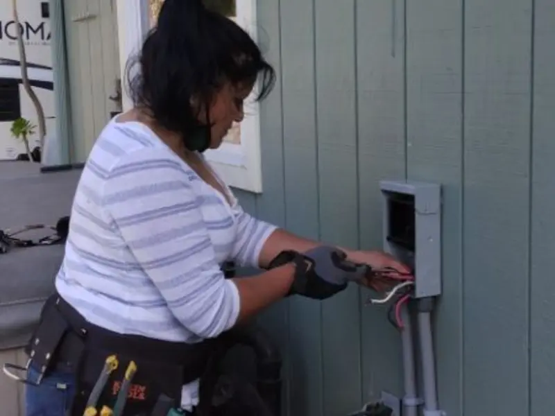 Licensed electrician wiring an exterior subpanel in Tiburon