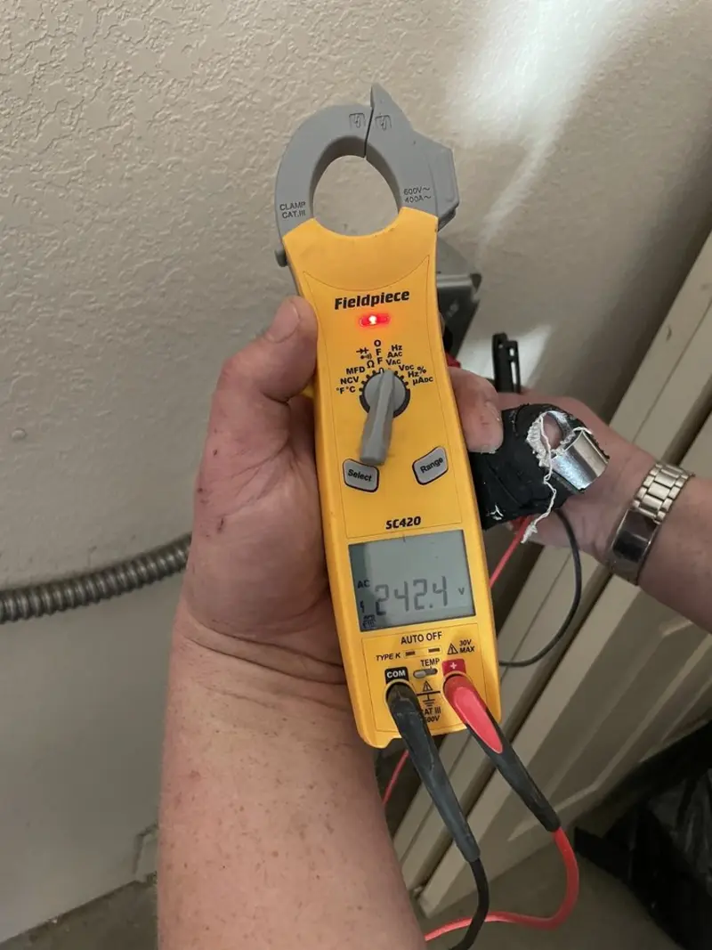 Voltage testing with clamp meter during Generator Installation in Tiburon